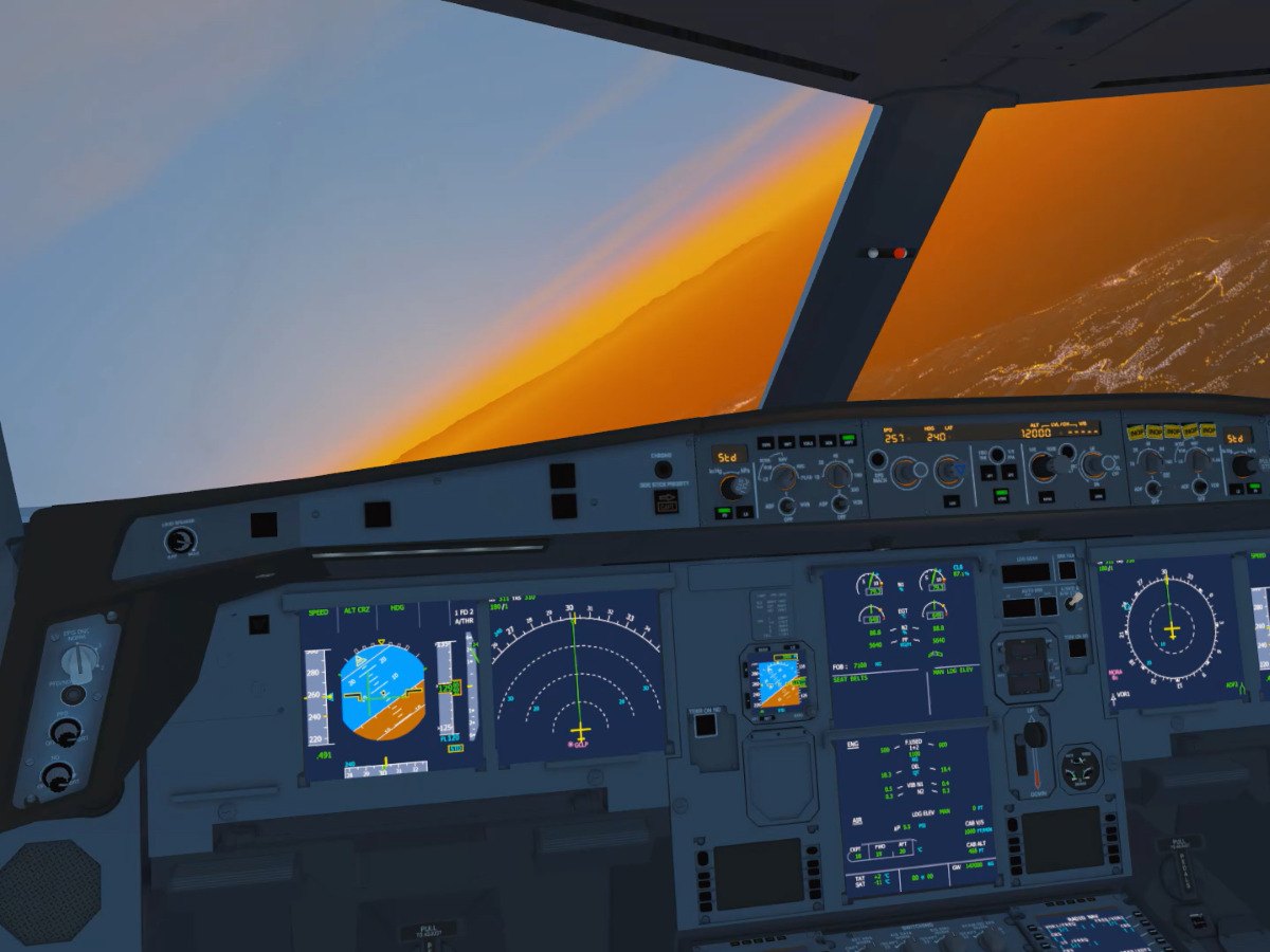The flight deck in the climb at sunset, displays lit